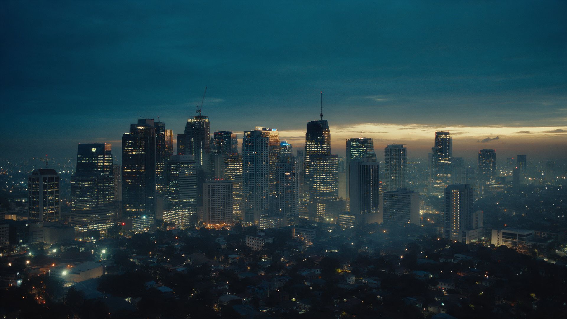 Makati skyline at blue hour, lights coming on in the office towers